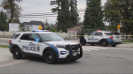 RCMP officers respond to a double-stabbing in Surrey, B.C., on Sept. 11, 2024. 