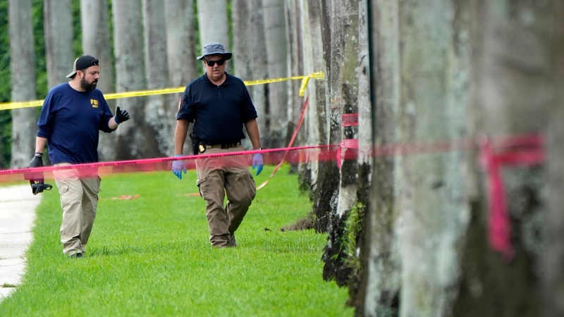 Law enforcement officials work outside of the Trump International Golf Club after the apparent assassination attempt of Republican presidential nominee and former President Donald Trump Monday, Sept. 16, 2024, in West Palm Beach, Fla. (AP Photo/Lynne Sladky)