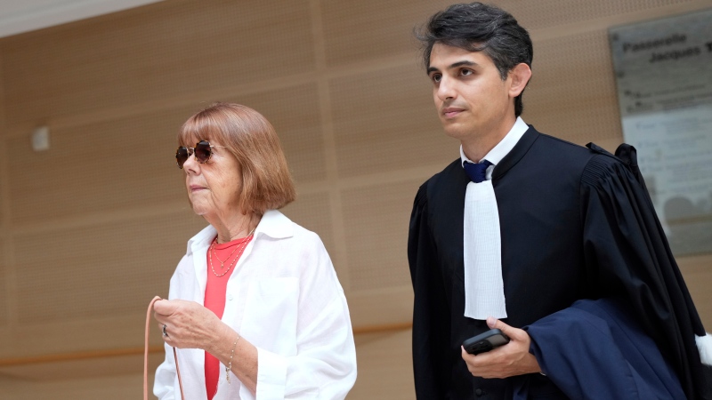 Gisele Pelicot, left, arrives in the Avignon court house, in Avignon, southern France, Thursday, Sept. 5, 2024. (AP Photo/Lewis Joly)
