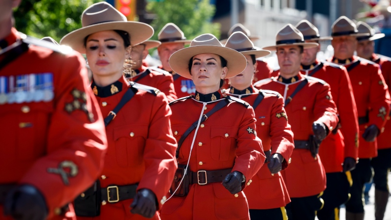 Members of the RCMP march during the Calgary Stampede parade in Calgary, Friday, July 5, 2024. (Source: THE CANADIAN PRESS/Jeff McIntosh)