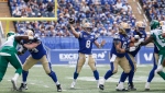 Winnipeg Blue Bombers quarterback Zach Collaros (8) throws against the Saskatchewan Roughriders during the first half of CFL Banjo Bowl action in Winnipeg Saturday, September 7, 2024. (John Woods/The Canadian Press)