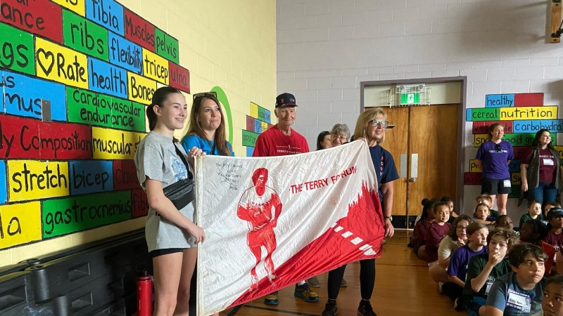 Students at Terry Fox Elementary run in tribute to Eddy Nolan, a beloved community figure who inspired many. 