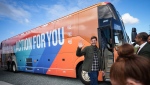 B.C. NDP leader David Eby waves as he gets back on his bus after a campaign stop at a supporter's farm, in Surrey, B.C., on Friday, September 20, 2024. THE CANADIAN PRESS/Darryl Dyck