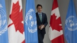 Prime Minister Justin Trudeau makes his way to the podium for a news conference at the Canadian Permanent Mission, in New York, Thursday, Sept. 21, 2023. THE CANADIAN PRESS/Adrian Wyld