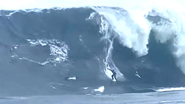 Surfer survives major wipeout in monster wave