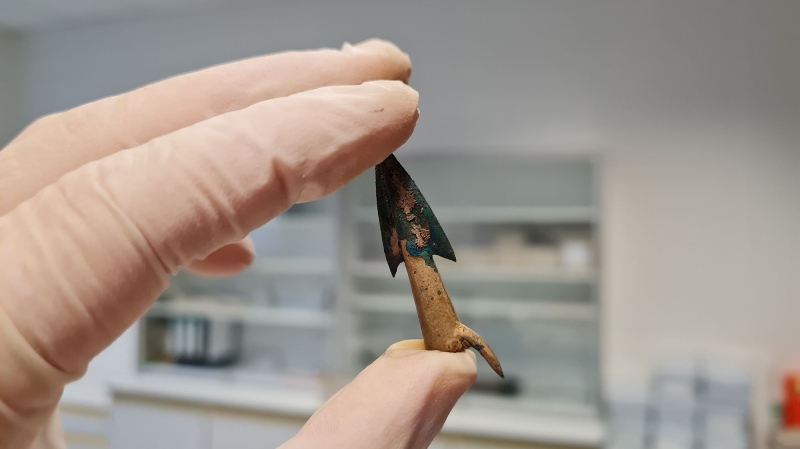 Lead study author Leif Inselmann holds one of the arrowheads recovered from Mecklenburg-Western Pomerania, a state in northeast Germany that’s home to the Tollense Valley. (Leif Inselmann via CNN Newsource)