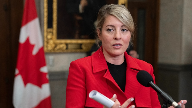 Minister of Foreign Affairs Melanie Joly speaks with reporters in the Foyer of the House of Commons before question period, Sept. 25, 2024, in Ottawa. THE CANADIAN PRESS/Adrian Wyld