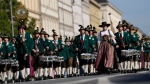 Bavarian musicians march during a traditional costume and riflemen's parade at the second day of the 189th 'Oktoberfest' beer festival in Munich, Germany, Sunday, Sept. 22, 2024. (AP Photo/Matthias Schrader)