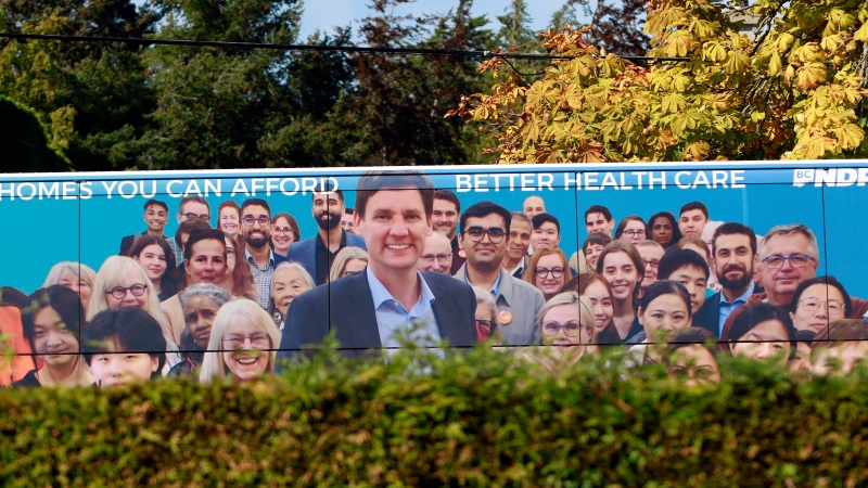 British Columbia NDP Leader David Eby arrives on his bus at Windsor Pavilion Park to greet fellow candidates and supporters during a campaign stop in the municipality of Oak Bay in Victoria, B.C., on Friday, September 27, 2024. THE CANADIAN PRESS/Chad Hipolito