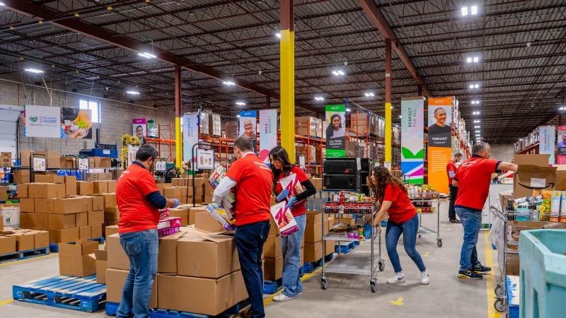 Volunteers pack food at a food bank in Mississauga. (Food Banks Mississauga photo)
