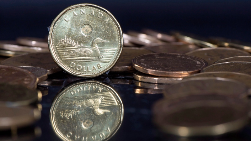 The Canadian dollar coin, the Loonie, is displayed Friday, January 30, 2015 in Montreal. THE CANADIAN PRESS/Paul Chiasson