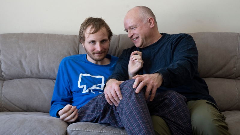 Andrew Kavchak and his son Steven are shown in their home in Ottawa on March 3, 2023. (Adrian Wyld / The Canadian Press)