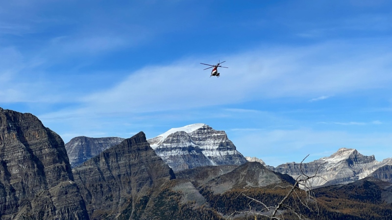 A helicopter is seen in the Pharaoh Lake area on Sept. 28, 2024, as Parks Canada responds to a report of a bear carcass.