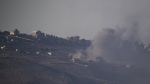 Smoke rises following an Israeli shelling in southern Lebanon as seen from northern Israel, Friday, Oct. 4, 2024. (AP Photo/Leo Correa)