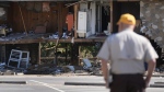 Paul Shaver looks a a building destroyed in the aftermath of Hurricane Helene Saturday, Oct. 5, 2024, in Newport, Tenn. (Jeff Roberson/AP Photo)