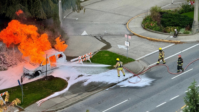 Firefighters extinguish a minivan on fire in front of Vancouver City Hall on Sunday, Oct. 6. (Courtesy: Sean Neill) 