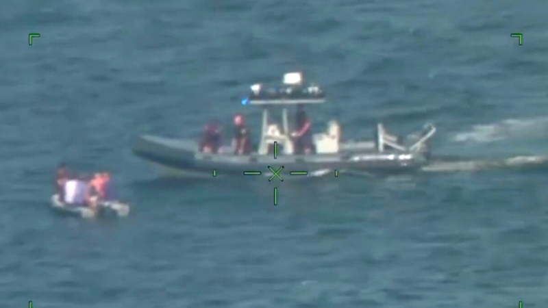 This still from a video shows a rescue boat approaching passengers of a private plane that crashed into the sea while they evacuated from Hurricane Milton, near St. Petersburg, Fla., on Oct. 8, 2024. (Source: USCG Southeast via Storyful)