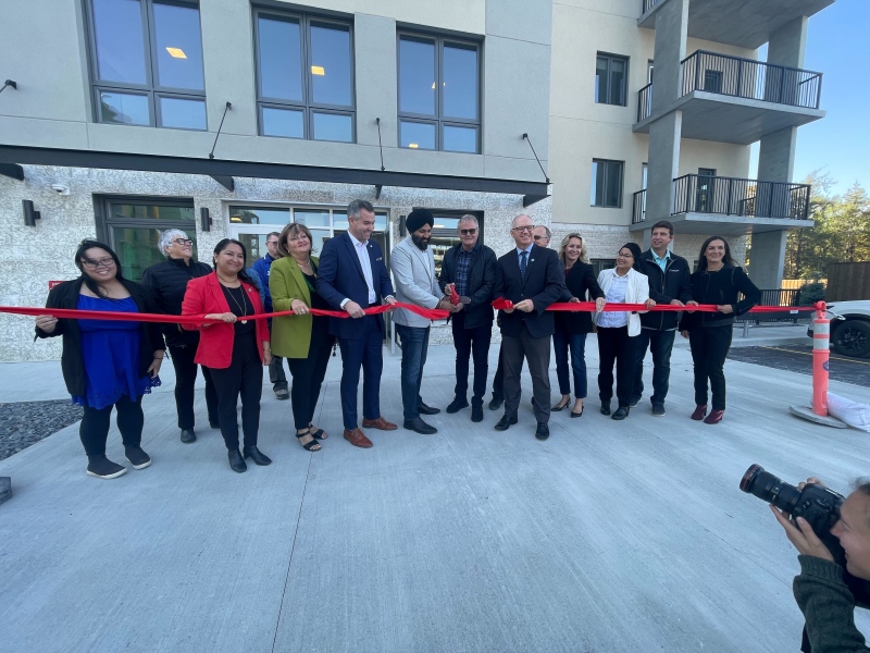 City officials, real estate developers, and community members celebrate the opening of the Seniors Residences of Oakdale on Oct. 9, 2024. (Jamie Dowsett/CTV News Winnipeg)