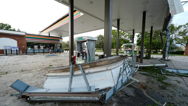 Debris and an awning of a gas station sits on the ground the morning after Hurricane Milton hit the region, Thursday, Oct. 10, 2024, in Tampa, Fla. (AP Photo/Julio Cortez)