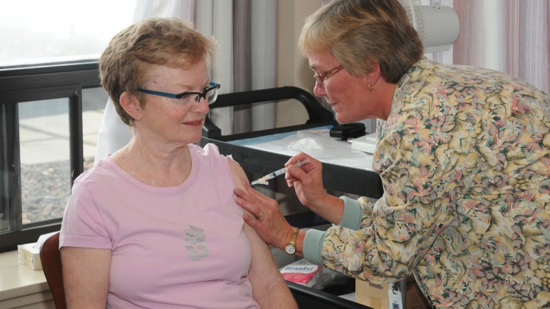 A woman receives flu vaccine in this file photo. (Source: Communications Nova Scotia)