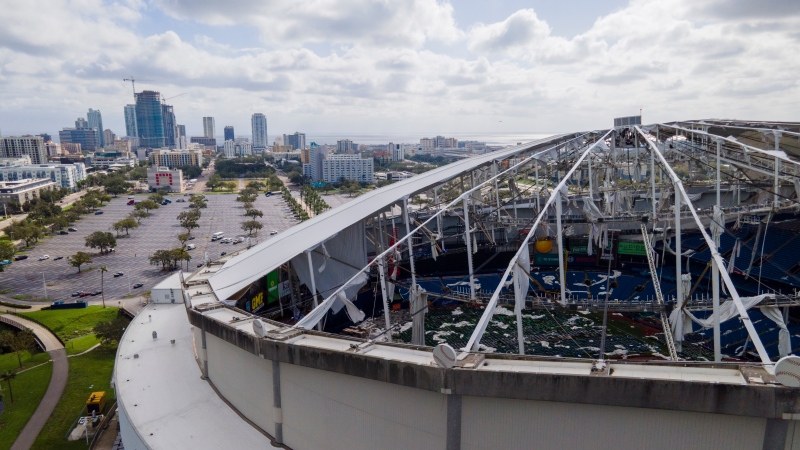 The roof of the Tropicana Field is damaged the morning after Hurricane Milton hit the region, Thursday, Oct. 10, 2024, in St. Petersburg, Fla. (AP Photo/Julio Cortez)