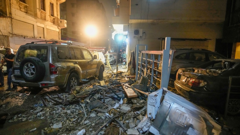 Debris and damage surround the site of an Israeli airstrike in Beirut, Lebanon, Oct. 10, 2024. (AP Photo/Hassan Ammar)