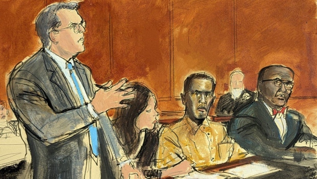 In this courtroom sketch, Sean 'Diddy' Combs' defence attorney Marc Agnifilo, left, addresses the judge while Combs, seated second from right, in prison uniform, watches in Federal court, in New York, Thursday, Oct. 10, 2024. (Elizabeth Williams via AP)