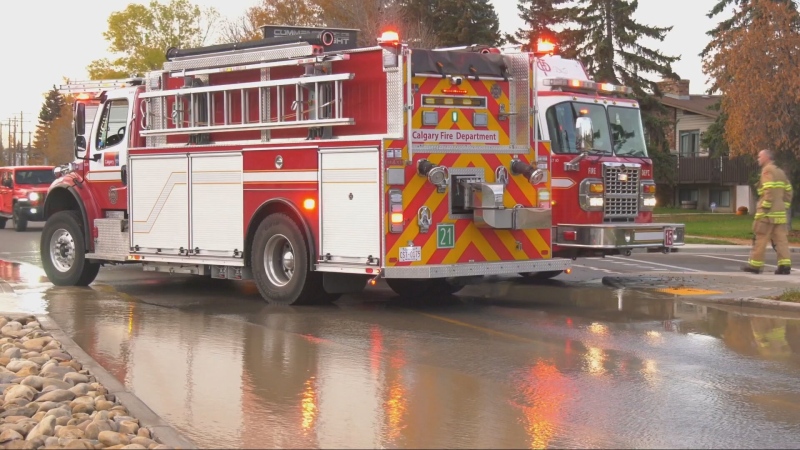 The Calgary Fire Department responds to a water main break on Bowness Road on Sunday, Oct. 13, 2024.