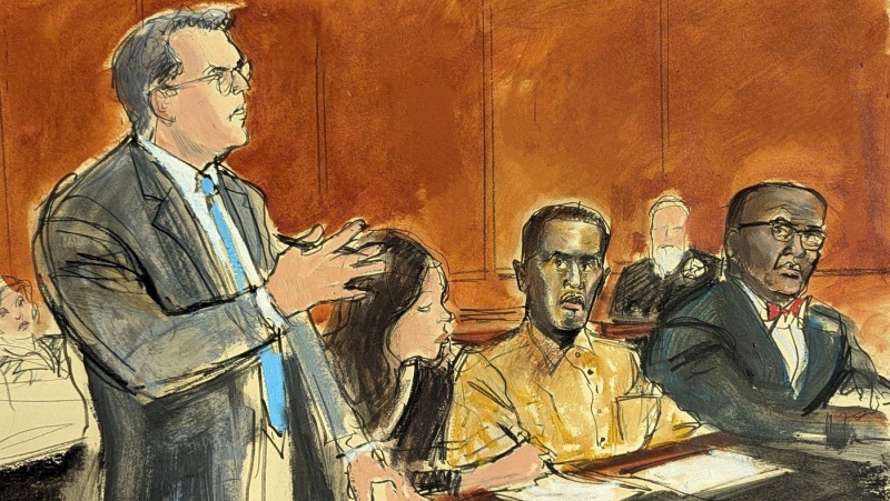 Sean "Diddy" Combs defence attorney Marc Agnifilo, left, addresses the judge while Combs, seated second from right, in prison uniform, watches in Federal court, in New York, Thursday, Oct. 10, 2024. (Elizabeth Williams via AP) 