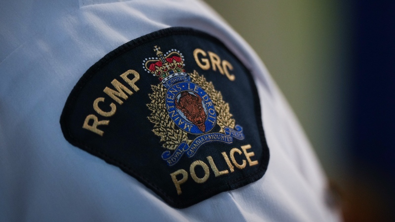 An RCMP patch is seen on the shoulder of Assistant Commissioner Brian Edwards, Officer in Charge of the Surrey RCMP, during a news conference about the city's municipal police force transition, in Surrey, B.C., on Friday, April 28, 2023. THE CANADIAN PRESS/Darryl Dyck 