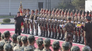 In this photo provided by the North Korean government, North Korean leader Kim Jong Un, left on red carpet, visits the headquarters of the North Korean People’s Army’s 2nd Corps at an undisclosed place in North Korea Thursday, Oct. 17, 2024. Independent journalists were not given access to cover the event depicted in this image distributed by the North Korean government. The content of this image is as provided and cannot be independently verified. (Korean Central News Agency/Korea News Service via AP)