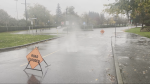 In West Vancouver, video shared with CTV News shows water shooting out from a manhole cover at Ambleside Park. (CTV News)