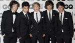 One Direction's Liam Payne, second from right, poses for a photo with fellow band members Harry Styles, Zayn Malik, Niall Horan and Liam Tomlinson at the 2011 GQ Men of the Year Awards. (Jonathan Short/AP Photo)