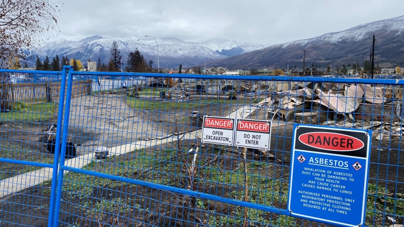 Fencing blocks access to wildfire-destroyed property at Geikie Street and Spruce Avenue in Jasper on Oct. 18, 2024. (Jeremy Thompson / CTV News Edmonton) 