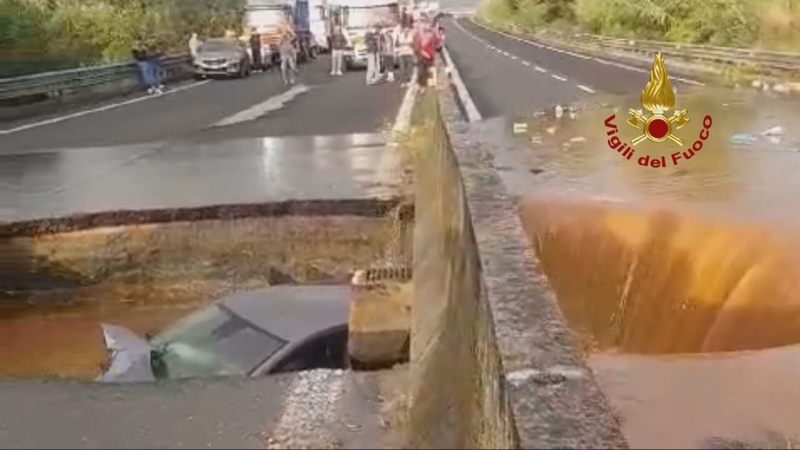 Sinkhole swallows car after heavy rainfall in Ital