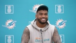 Miami Dolphins quarterback Tua Tagovailoa smiles as he takes questions during a news conference, Monday, Oct. 21, 2024. (AP Photo/Wilfredo Lee)