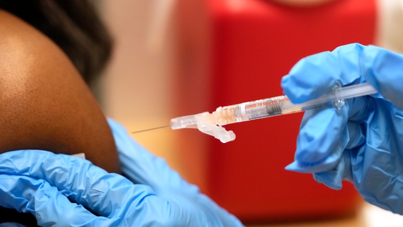 Pharmacist Kim Nguyen administers a Moderna Spikevax COVID-19 vaccine at a CVS, Wednesday, Sept. 20, 2023, in Cypress, Texas. (Melissa Phillip/Houston Chronicle via AP)