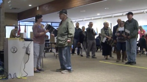 Voters in Fredericton line up to cast their ballot at a Elections New Brunswick tabulator machine, in a file photo. (Nick Moore/CTV Atlantic)