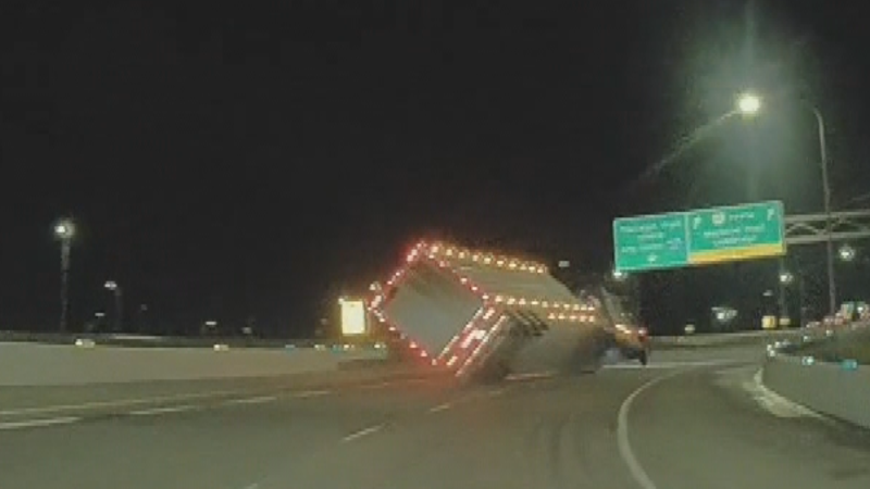 A semi-truck hauling cattle rolls over on an off ramp from Stoney Trail to Macleod Trail in Calgary. The crash killed 17 cows. (FeistySyllabub3580/Reddit) 