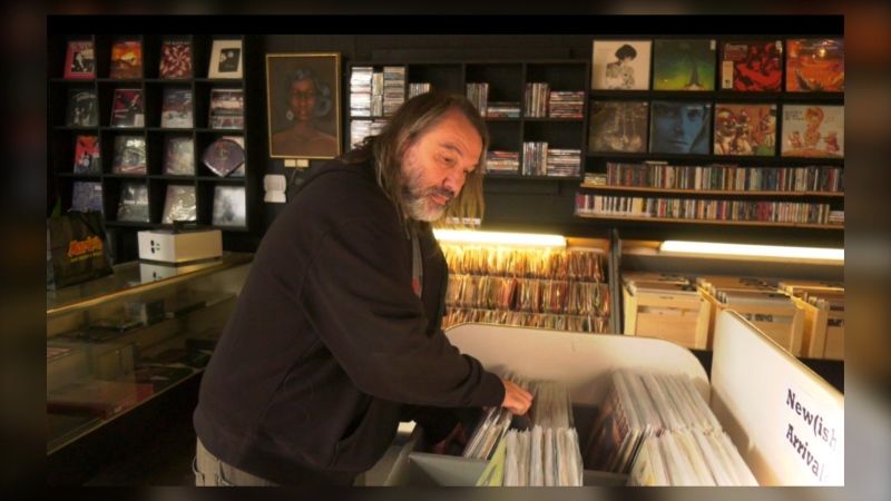 Peter Dul has been collecting vinyl for over four decades and will often make a road trip looking for his next big vinyl record purchase. Inside Duly Records, he sorts new arrivals on a daily basis including here on Thursday Oct. 17, 2024. (Joseph Bernacki/CTV News Winnipeg)