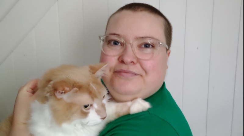 Heather Thompson, pictured with their emotional support cat Captain Kirk in this recent handout photo, hoped the Canada Disability Benefit would help them out of poverty, but that hope has been dashed. (THE CANADIAN PRESS/HO - Heather Thompson)