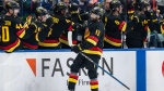 Vancouver Canucks' Arshdeep Bains celebrates his goal with teammates during the second period of an NHL hockey game against the Pittsburgh Penguins in Vancouver, on Saturday, October 26, 2024. THE CANADIAN PRESS/Ethan Cairns