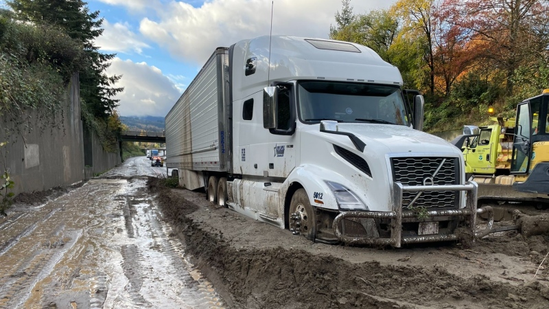 This photo from the Washington State Department of Transportation shows a semi-truck stuck in a mudslide on Oct. 27, 2024. 