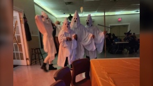 Pictures submitted to CTV News show four people dressed in long white robes and pointed hoods at a Halloween dance in North Sydney, N.S., on Oct. 26, 2024. (Source: Facebook)