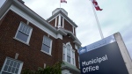 A Canadian flag is seen on the pole outside the Strathroy-Caradoc municipal office in Strathroy, Ont. on Oct. 29, 2024. (Bryan Bicknell/CTV News London)