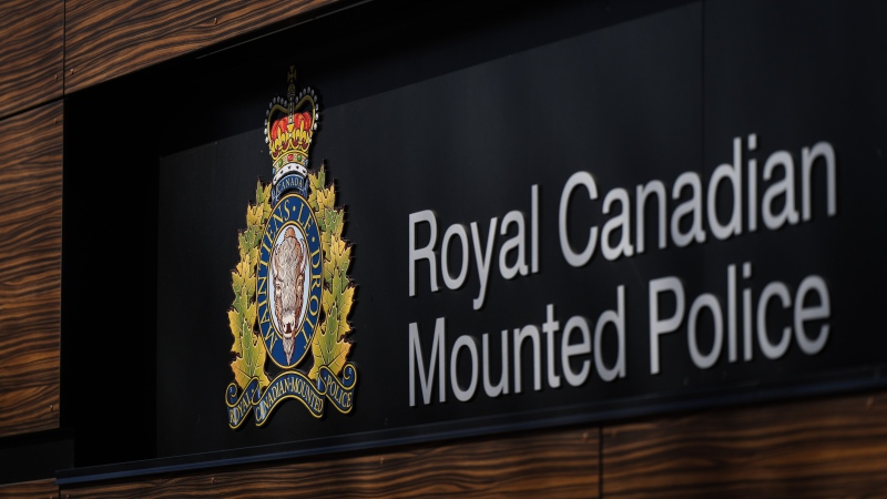 The RCMP logo is seen outside the force's 'E' division headquarters in Surrey, B.C., on March 16, 2023. (Darryl Dyck / The Canadian Press)