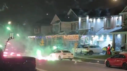 Fireworks can be seen exploding on a Breslau street in this image taken from a video released by Waterloo Regional Police. (Courtesy: Waterloo Regional Police Service)