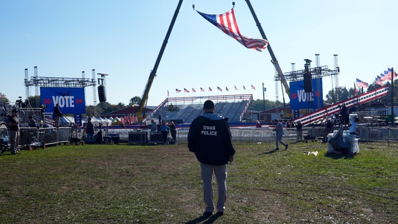 A U.S. Secret Service agent looks at the site before Republican presidential nominee former president Donald Trump speaks at a campaign rally at the Butler Farm Show, Oct. 5, 2024, in Butler, Pa. (AP Photo/Alex Brandon)