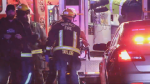 Firefighters and paramedics load a pedestrian into an ambulance after a collision Friday night. (CTV News)