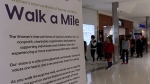 Domestic violence survivors and allies walk through Lambton Mall in Sarnia, Ont. on Saturday, Nov. 2, 2024 (Source: Brent Lale/CTV London) 